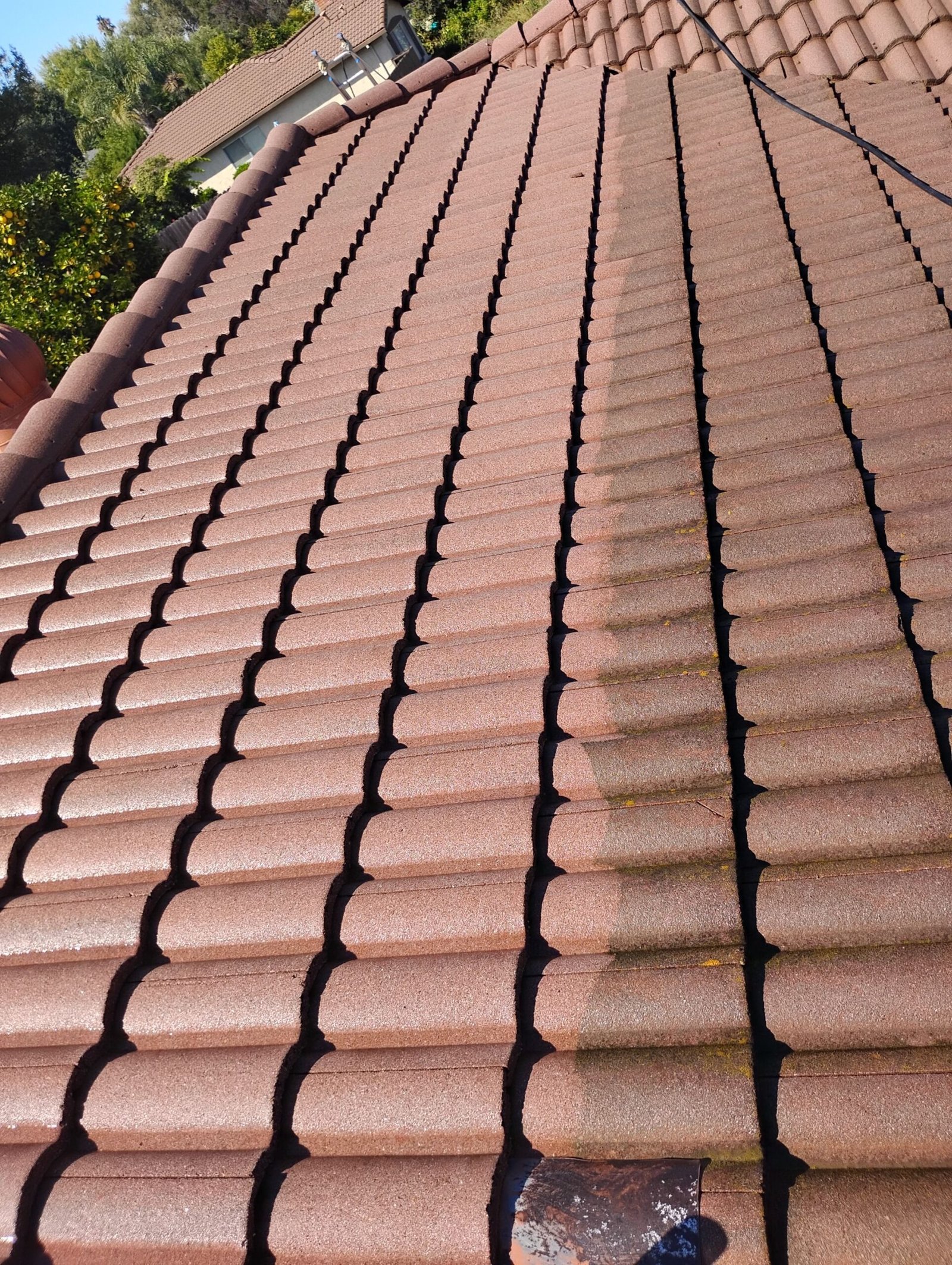 Tile roof soft washing on a Concord home